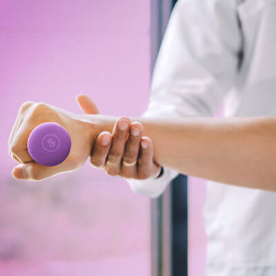 Stroke rehab image callout. Image of patient holding weight.