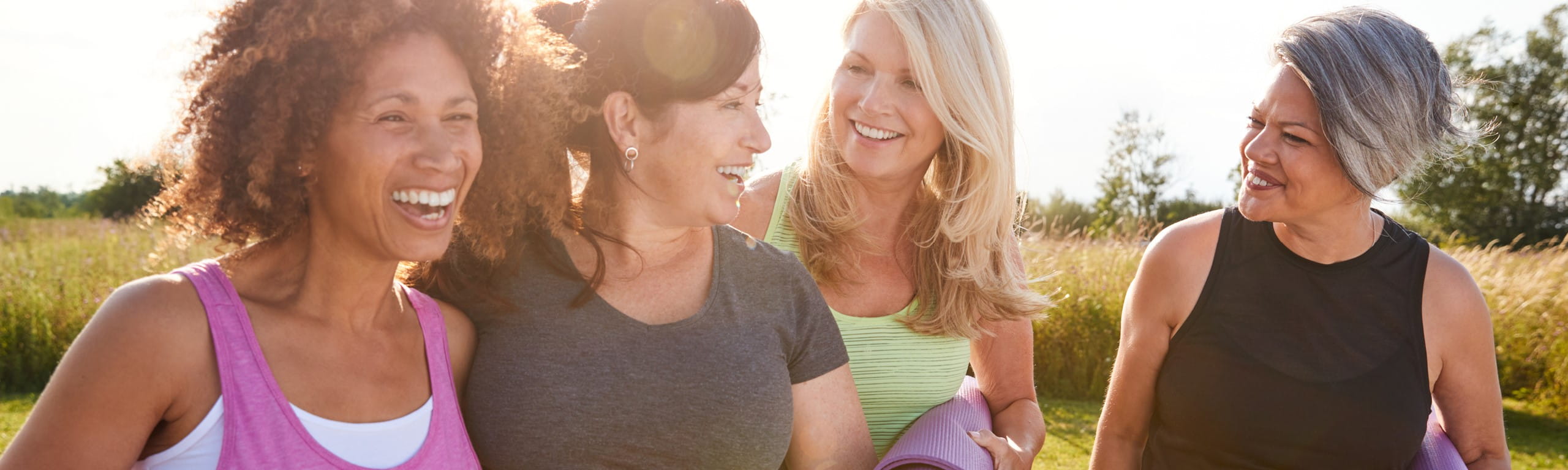 Photo of a group of women laughing together.