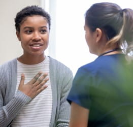 Woman speaking with doctor