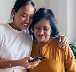 Two woman looking at phone