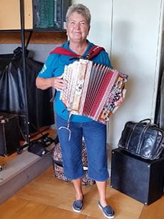 Judy playing accordion.