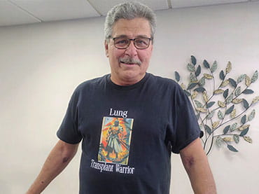Peter Zatezalo wearing a Lung Transplant Warrior t-shirt.